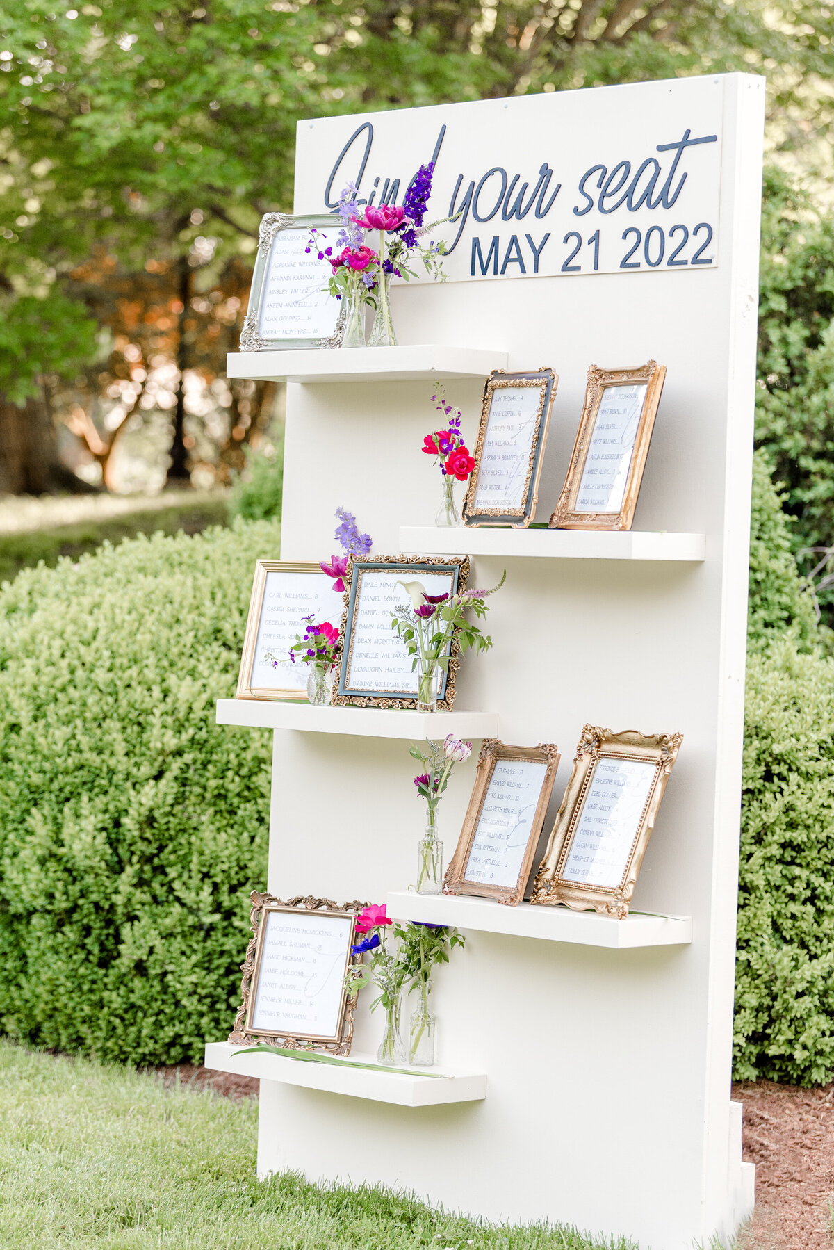 Wedding flower arrangements with antique bud vases. Fully custom floral design by The Garden Studio LLC. Wedding florist for Eastern Shore wedding venues.