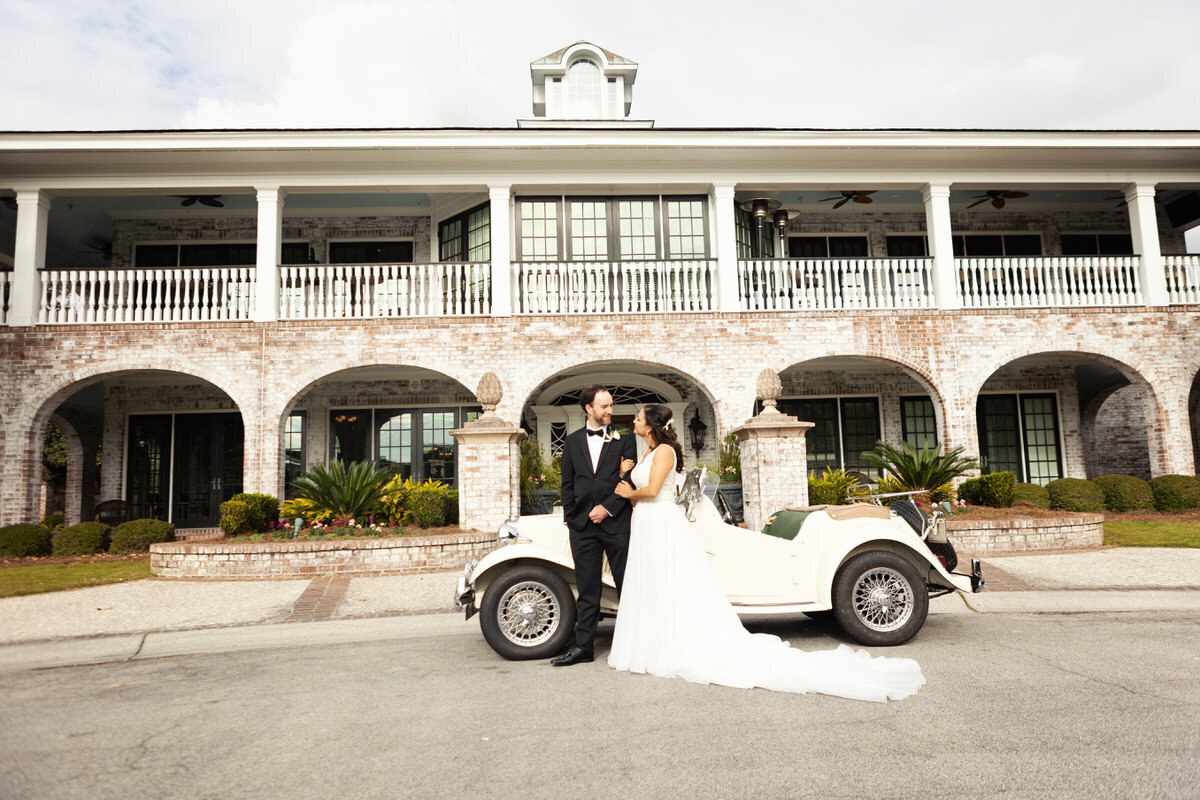Bride and groom with vintage car at Dunes West Golf and River Club wedding Charleston Wedding Photographer