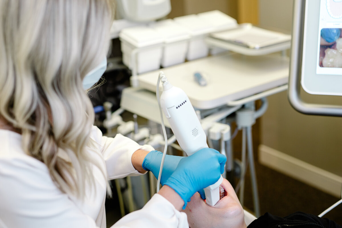 Women cleaning teeth dental office brand photo