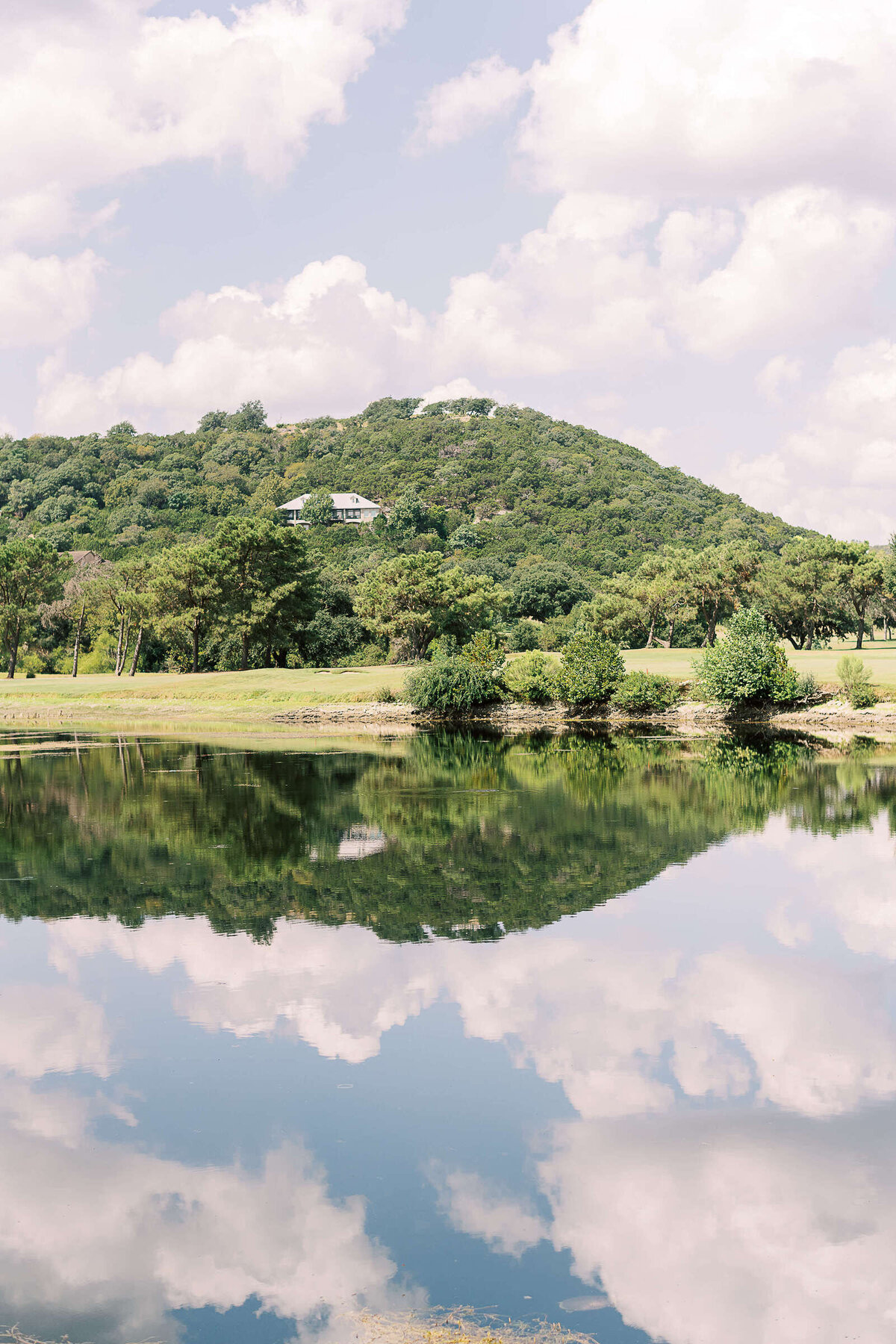 Lake and hill view of elegant wedding in Texas hill country