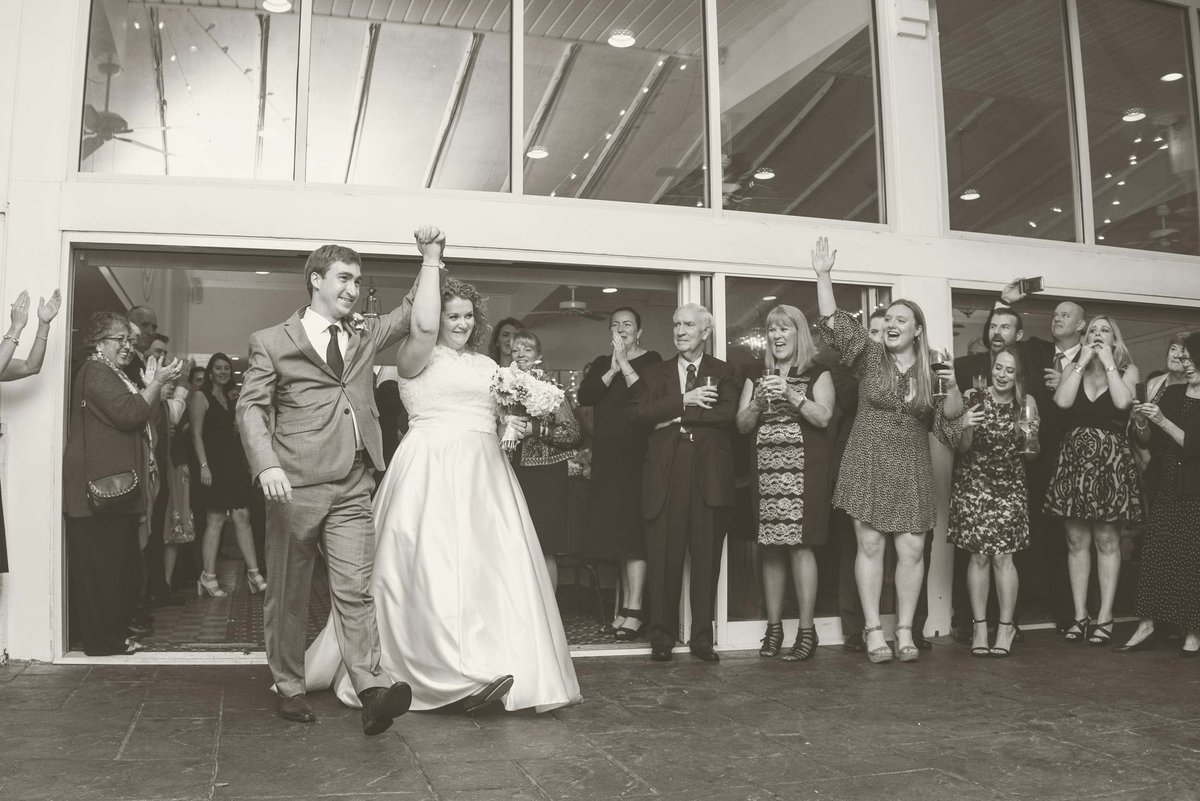 Bride and groom entering room at Head of the Bay Club