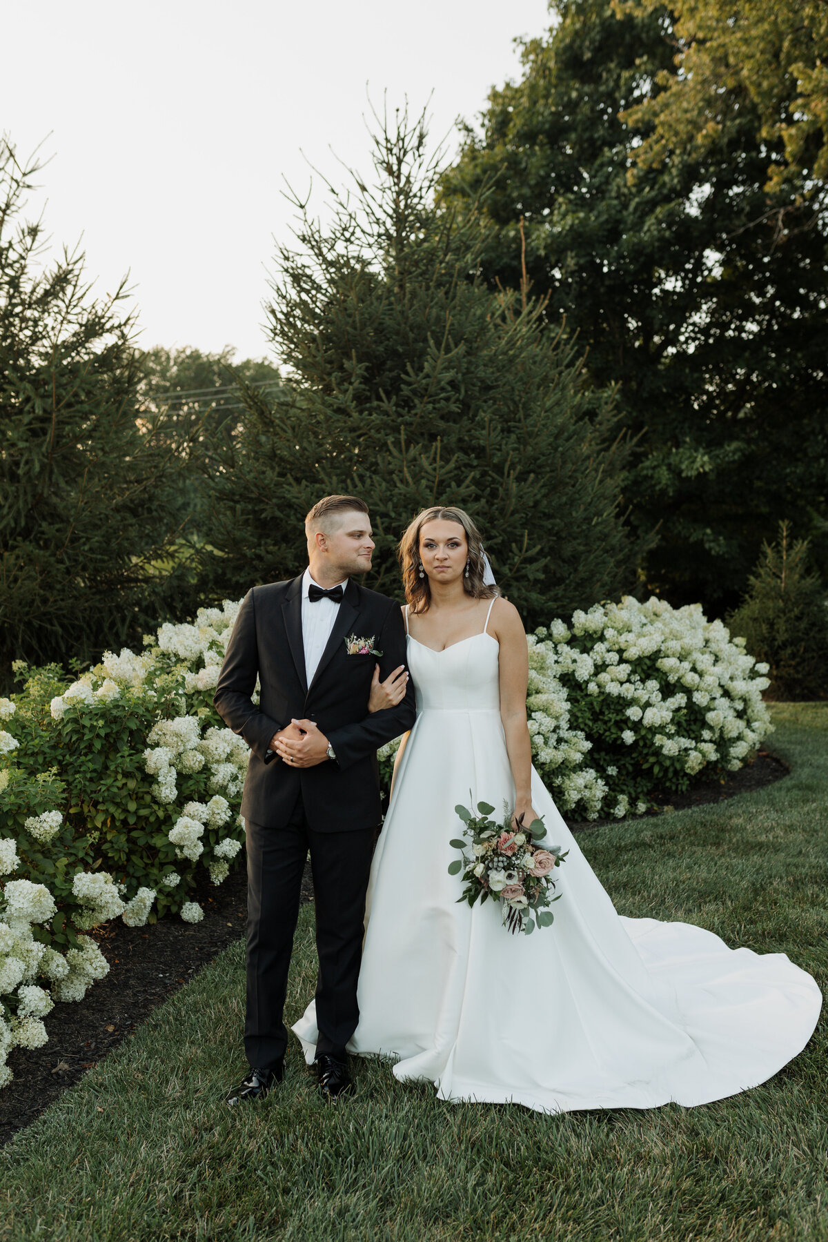 Ryann photographing a couple, bringing authenticity and warmth to wedding photography in Indiana and beyond.