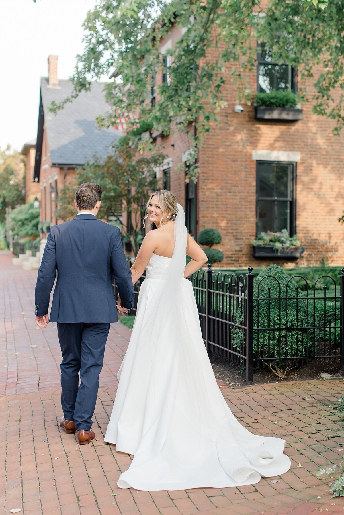 Bride and Groom walking in downtown Columbus, Ohio taken by Ohio Wedding Photographer
