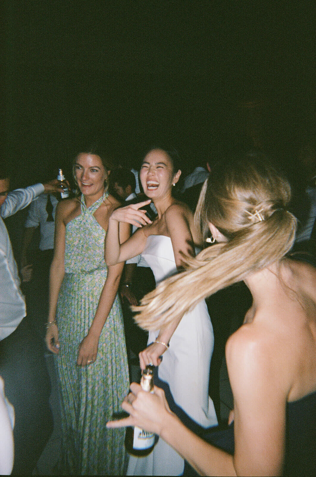 Bride joyfully dances with her friends all night at the Aspen Meadows Resort wedding reception venue.