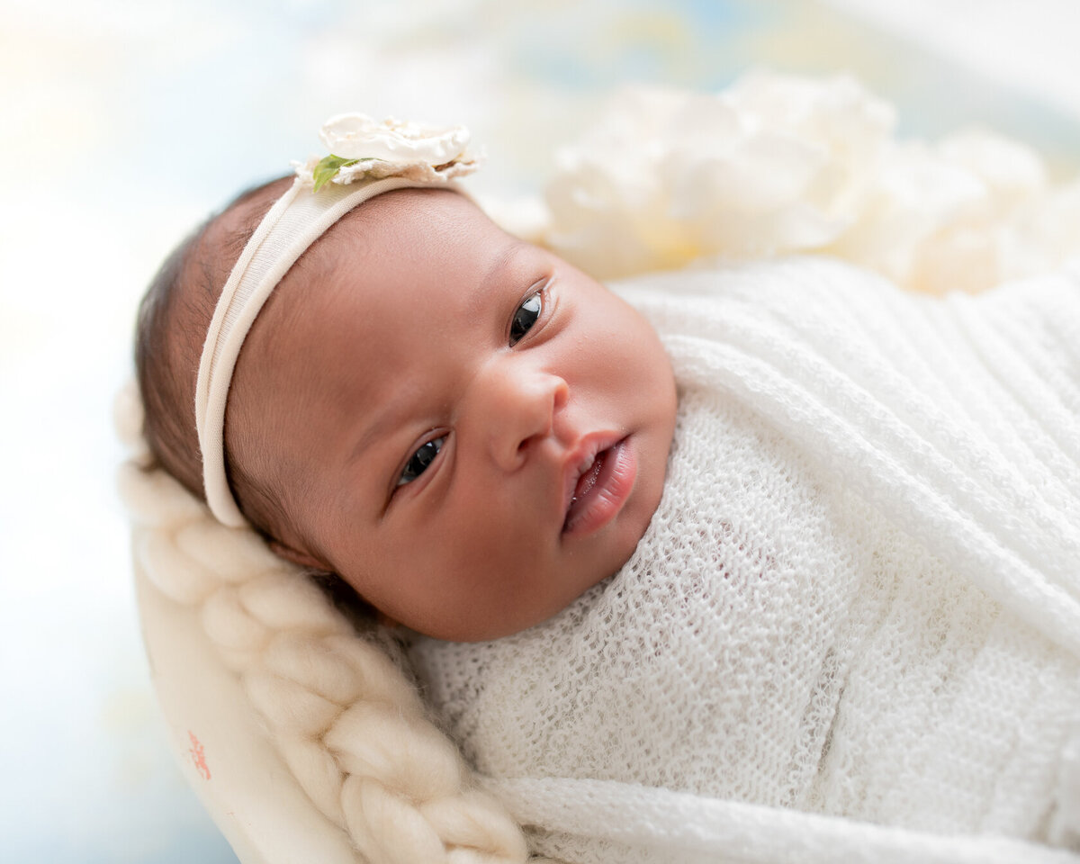 Adorable wrapped newborn photo by Laura King Photography