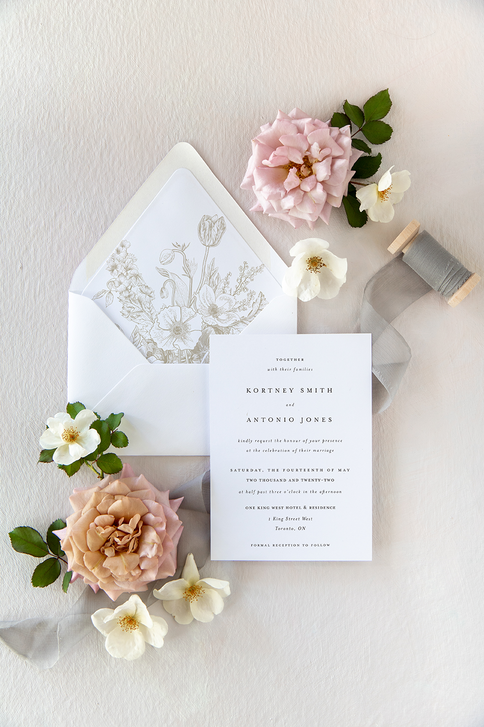 Simple minimalistic wedding invitation card with printed floral envelope liner