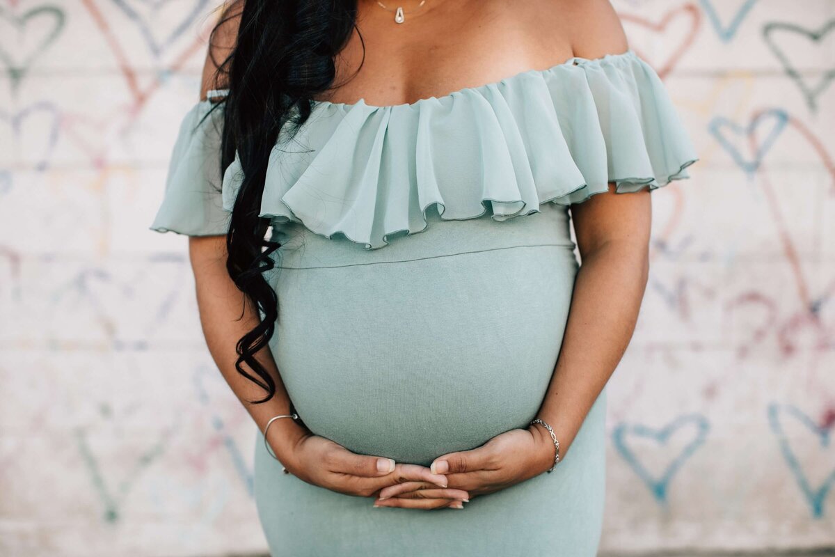 Cropped Shot of a Pregnant Woman Wearing a Maternity Dress