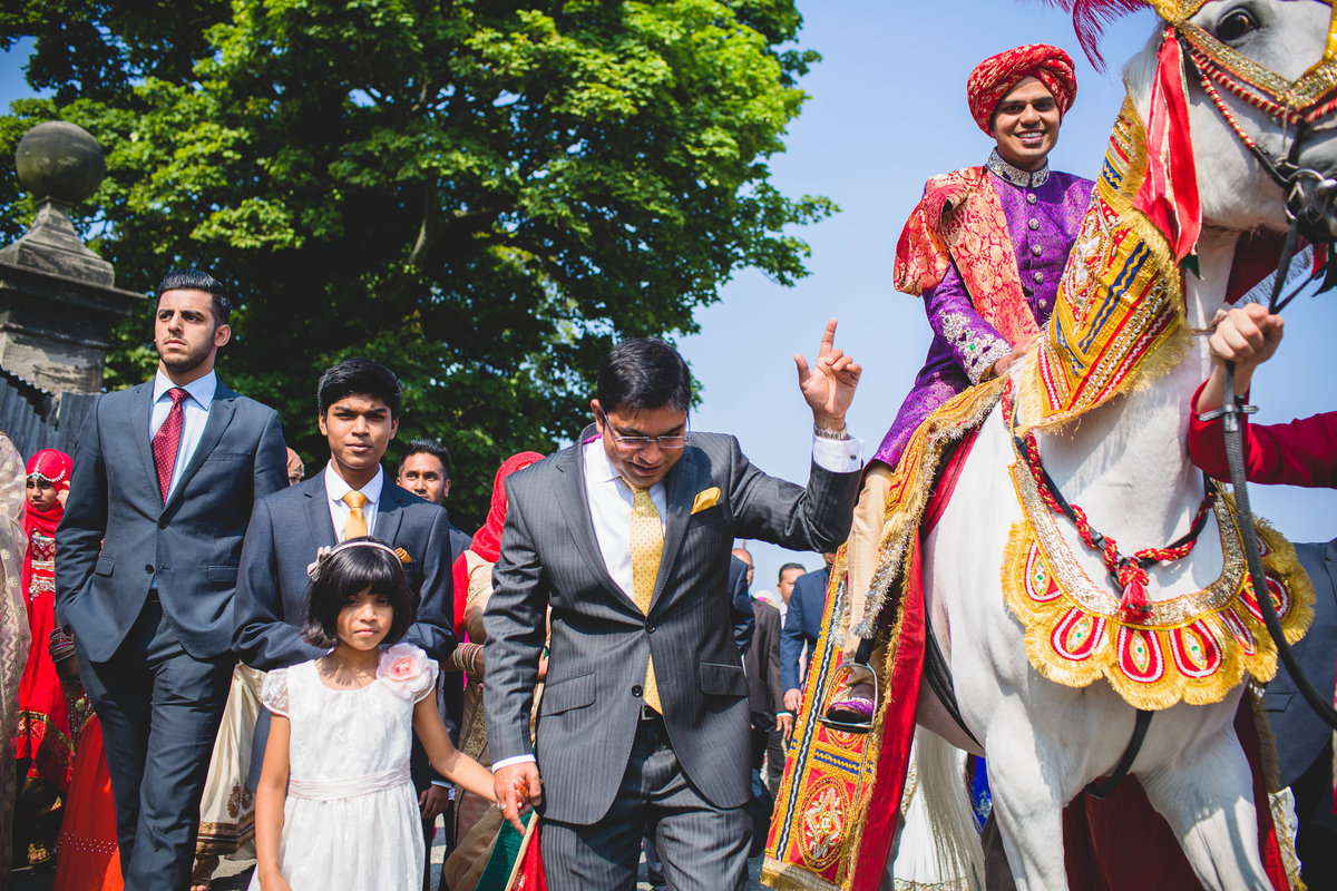 asian wedding groom horse thornton manor