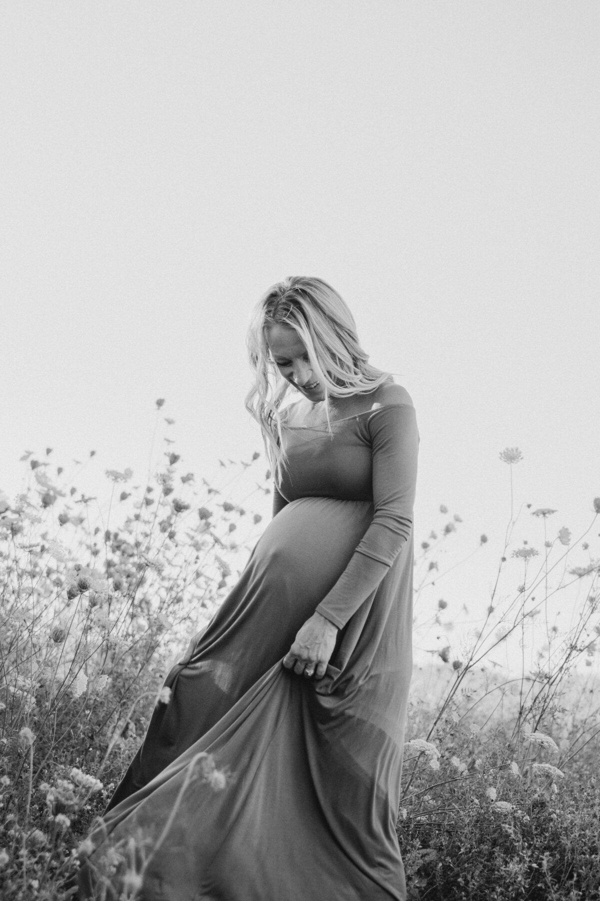 Summer maternity session in flower field