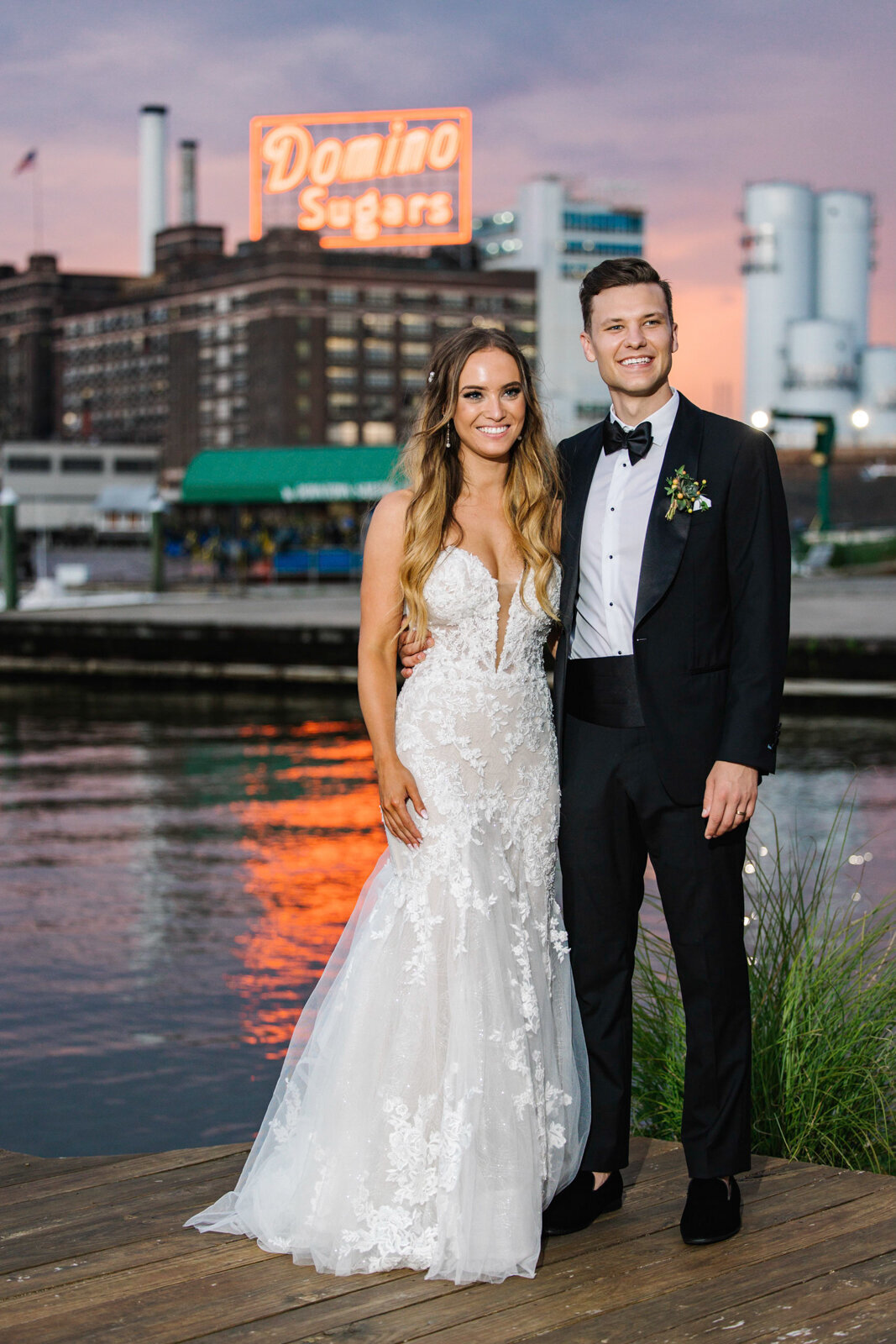 Sunset wedding photos in front of the Domino Sugars Sign