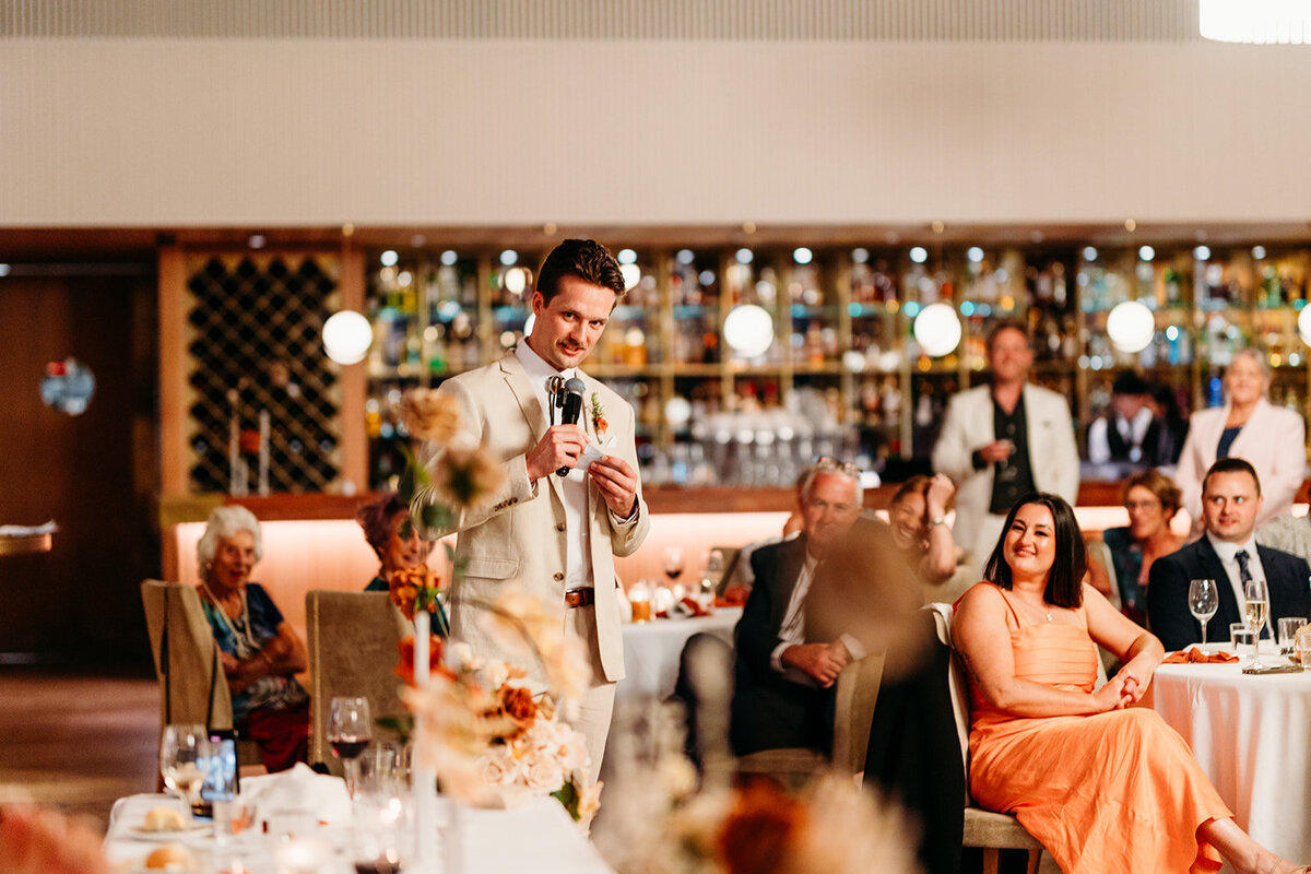 Groomsmen giving a speech at a wedding reception at The Marion