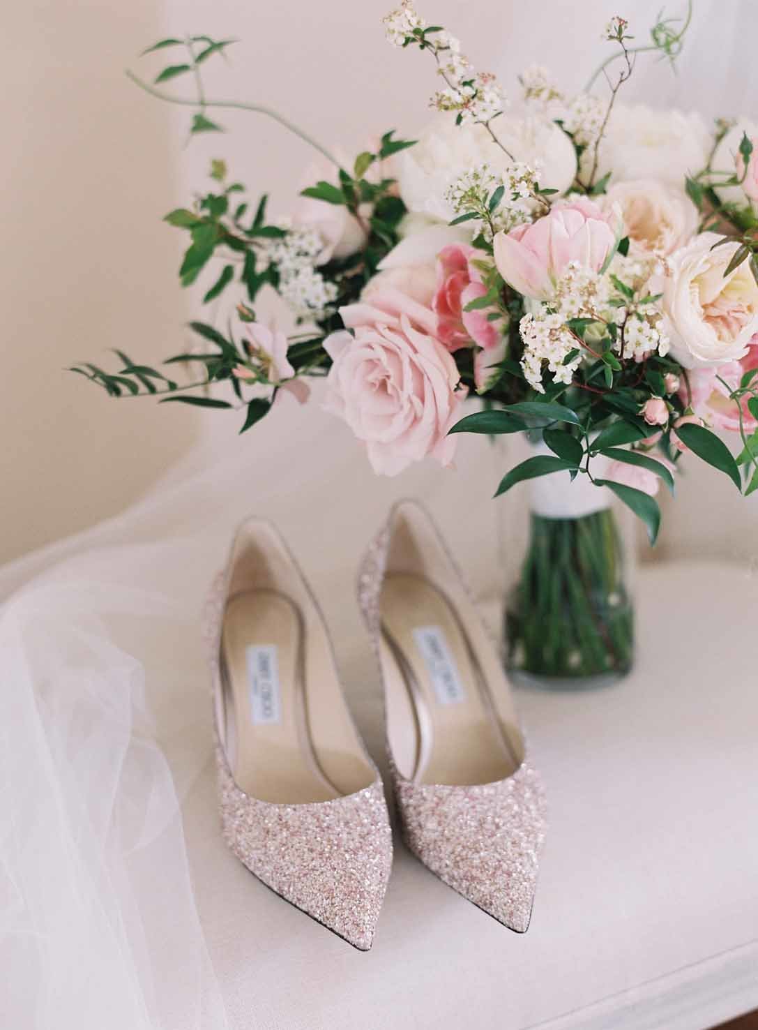 sparkly gold bridal shoes with bridal bouquet