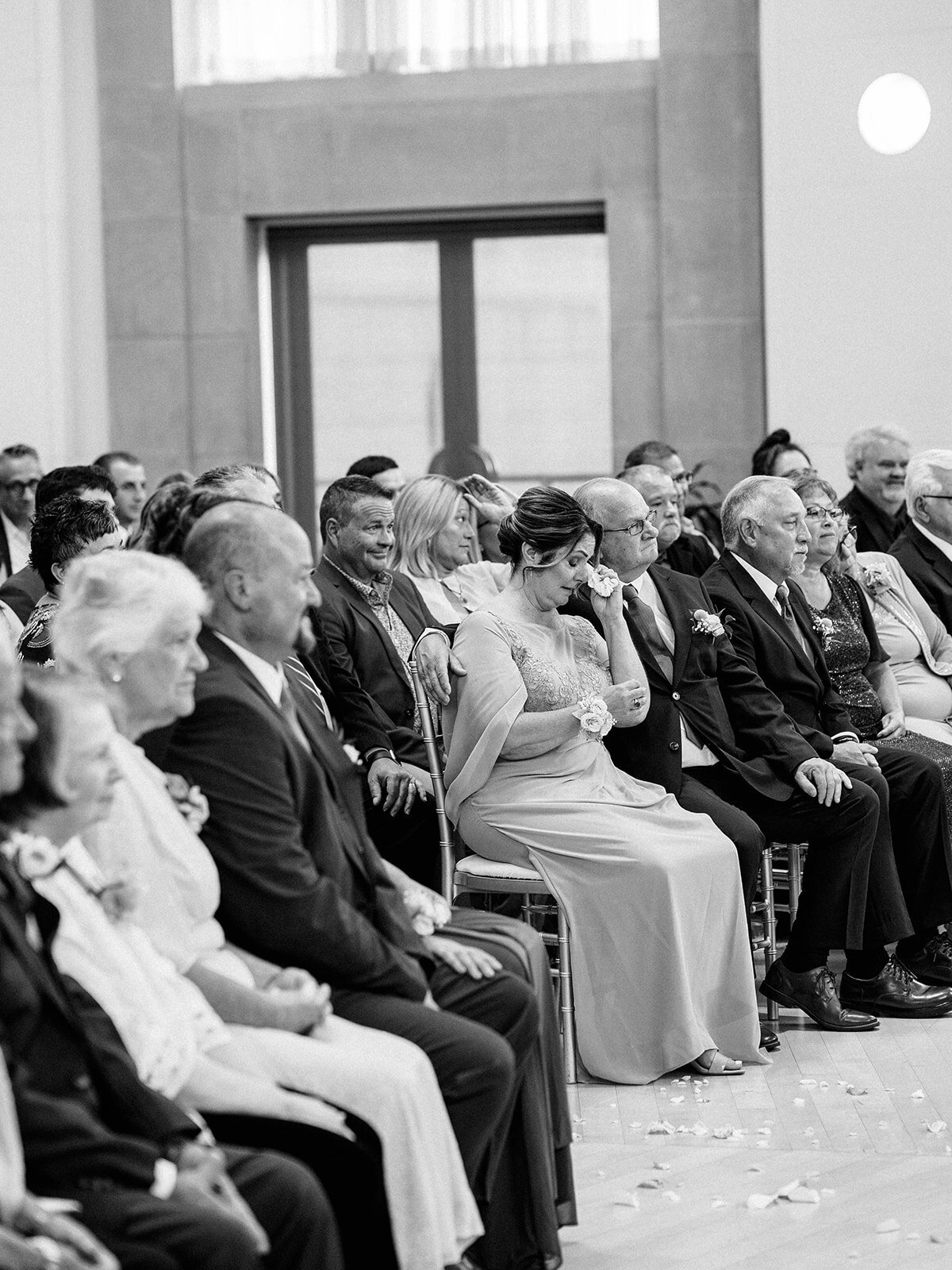 Mom having an emotional moment at her daughters wedding