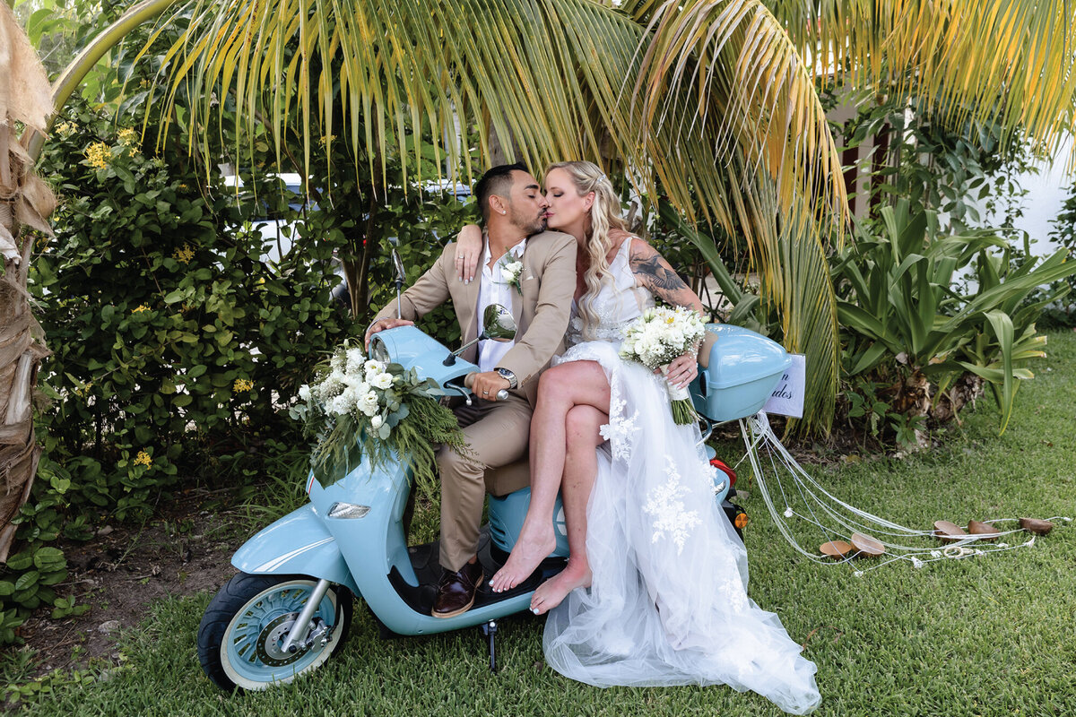 bride-kissing-groom-on-bike