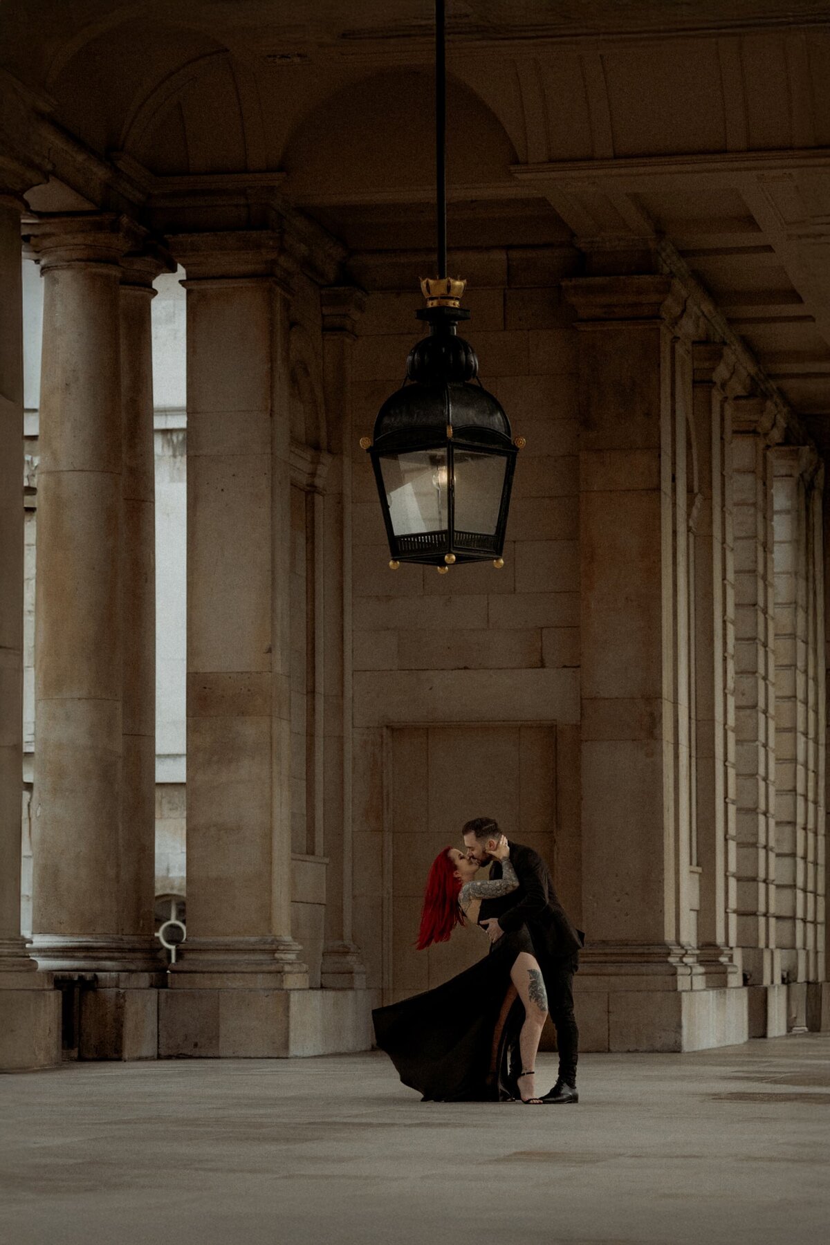 A romantic Couple kissing  at Old Royal Naval College Greenwich posing for London elopement photographer Hadi Photography
