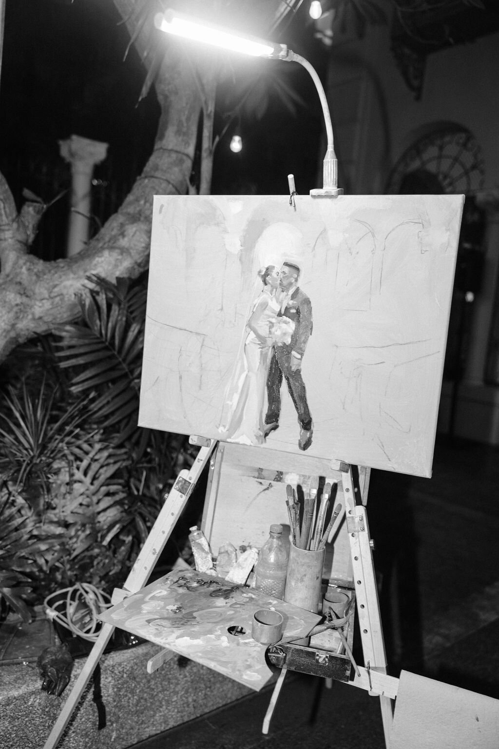 Paining of bride and groom part way finished in black and white