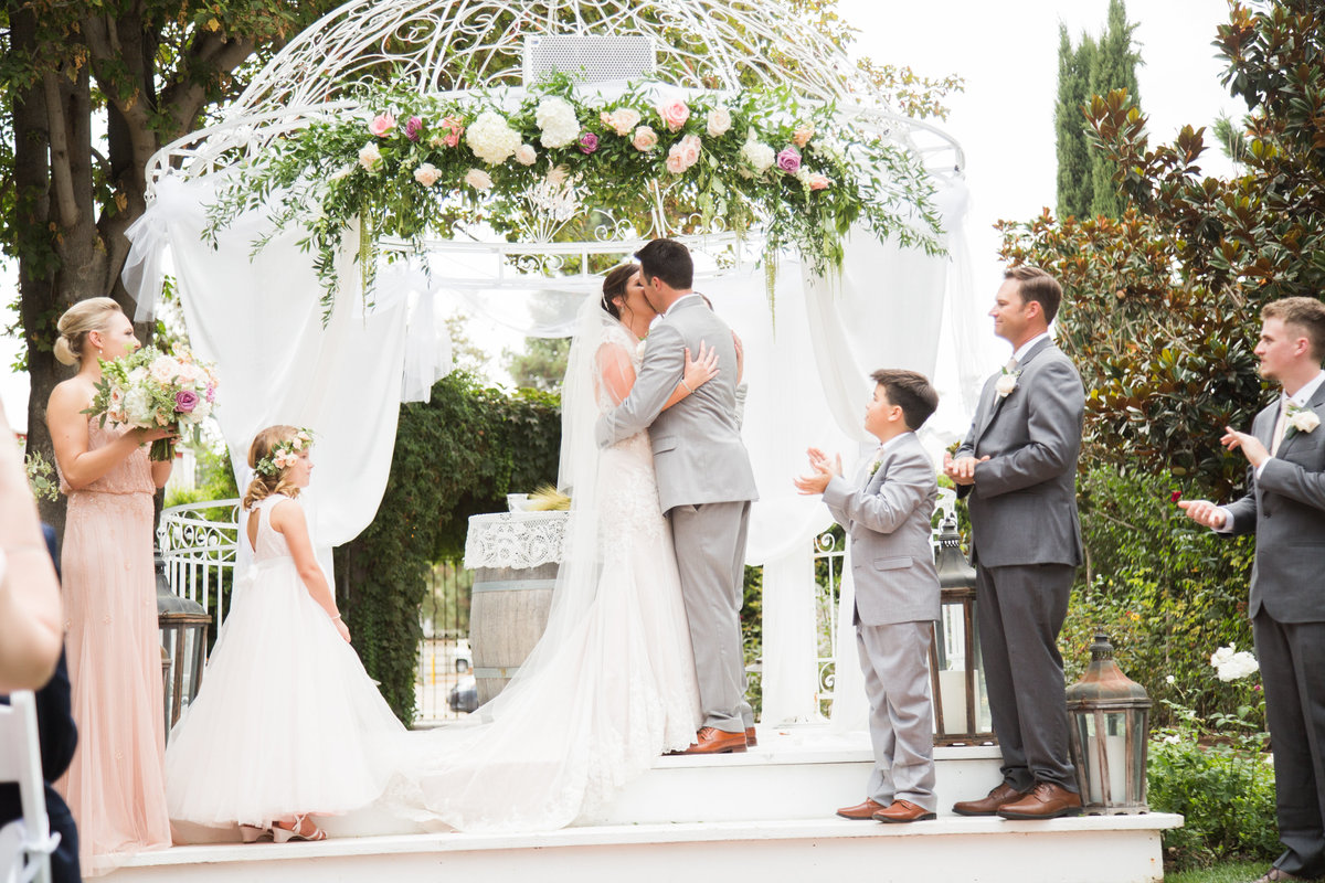 Bride and groom kiss at 1880 Union Hotel Wedding