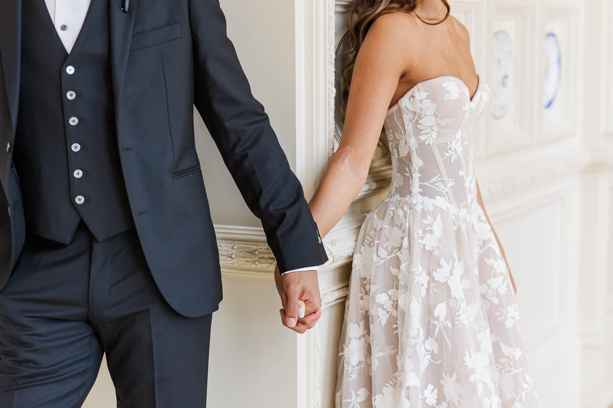couple-sharing-a-first-touch-before-their-wedding