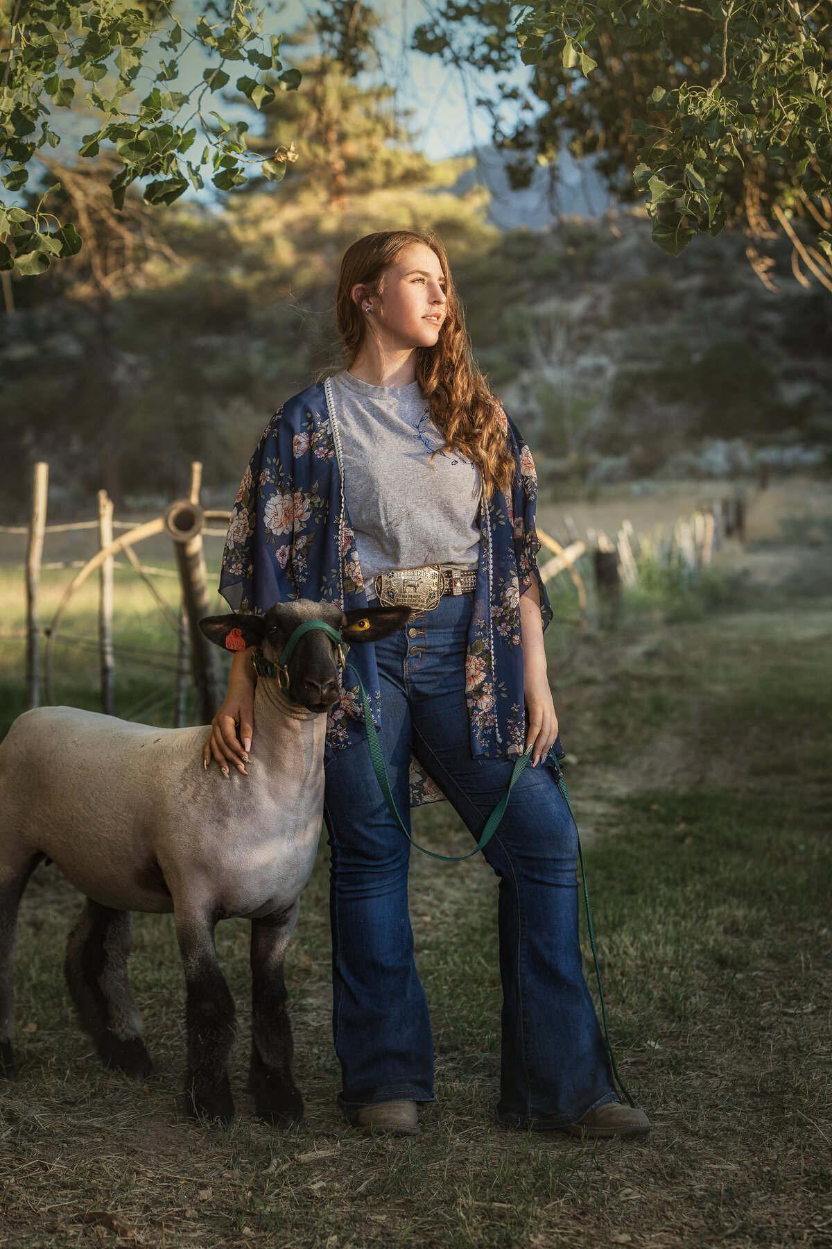 girl standing with lamb