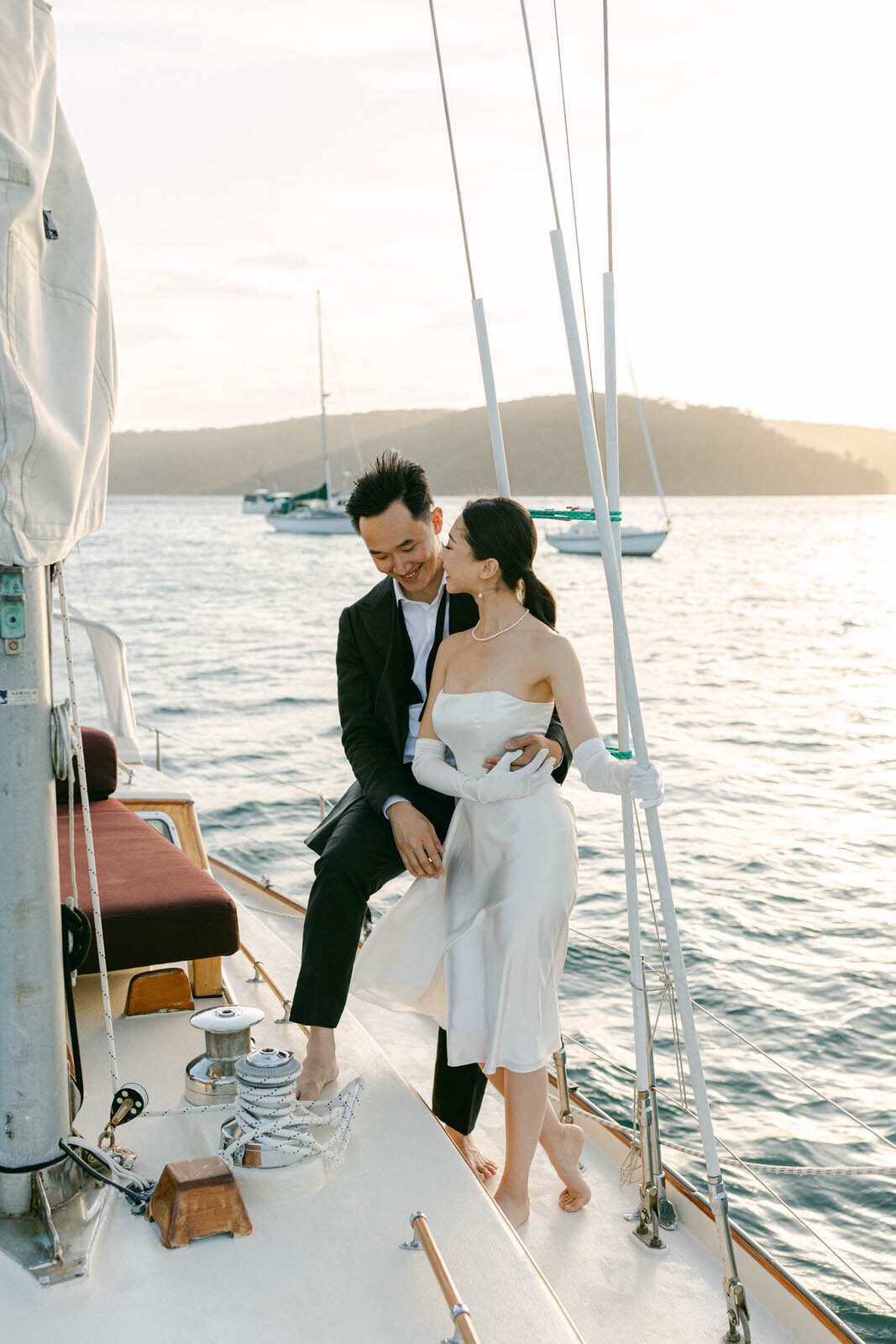 Engaged couple on a sailboat