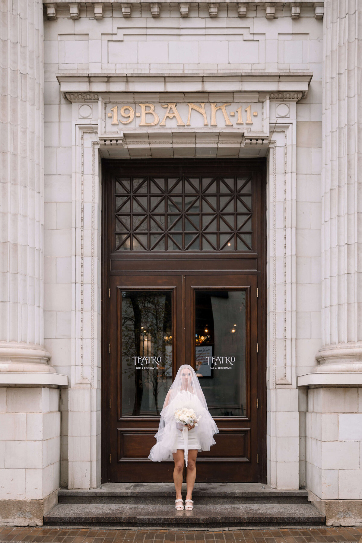 bride-standing-outside-courthouse-nika-helgeson-photography