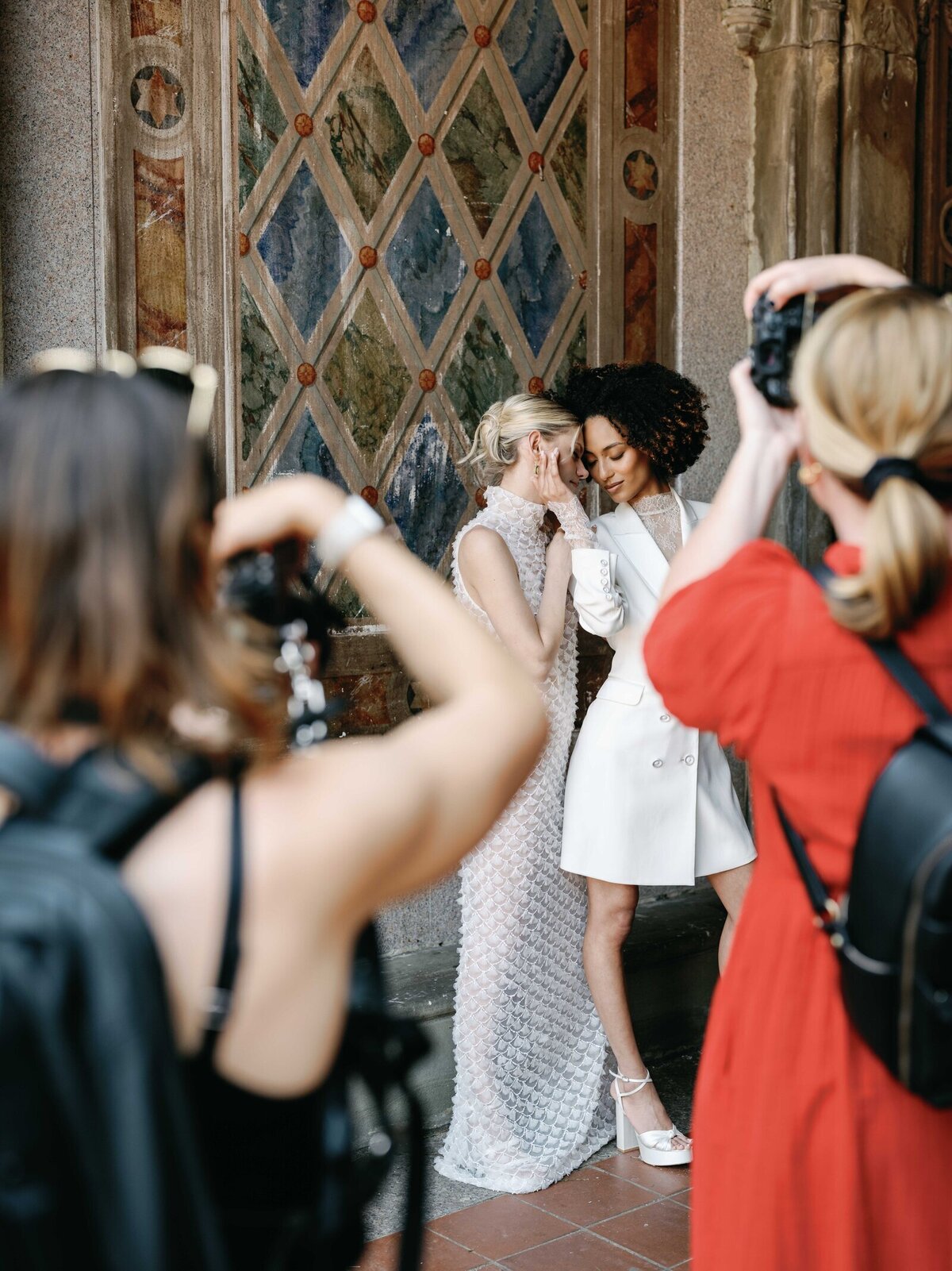 Photographers capturing romantic bridal portraits