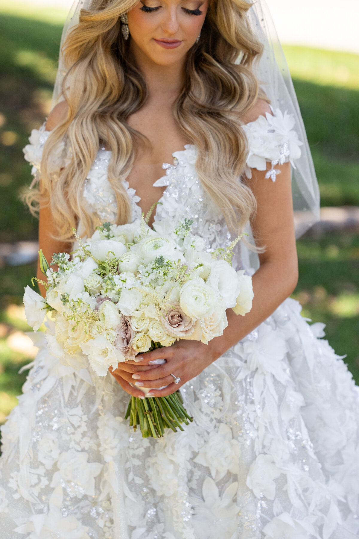 A bride holding a bouquet of flowers