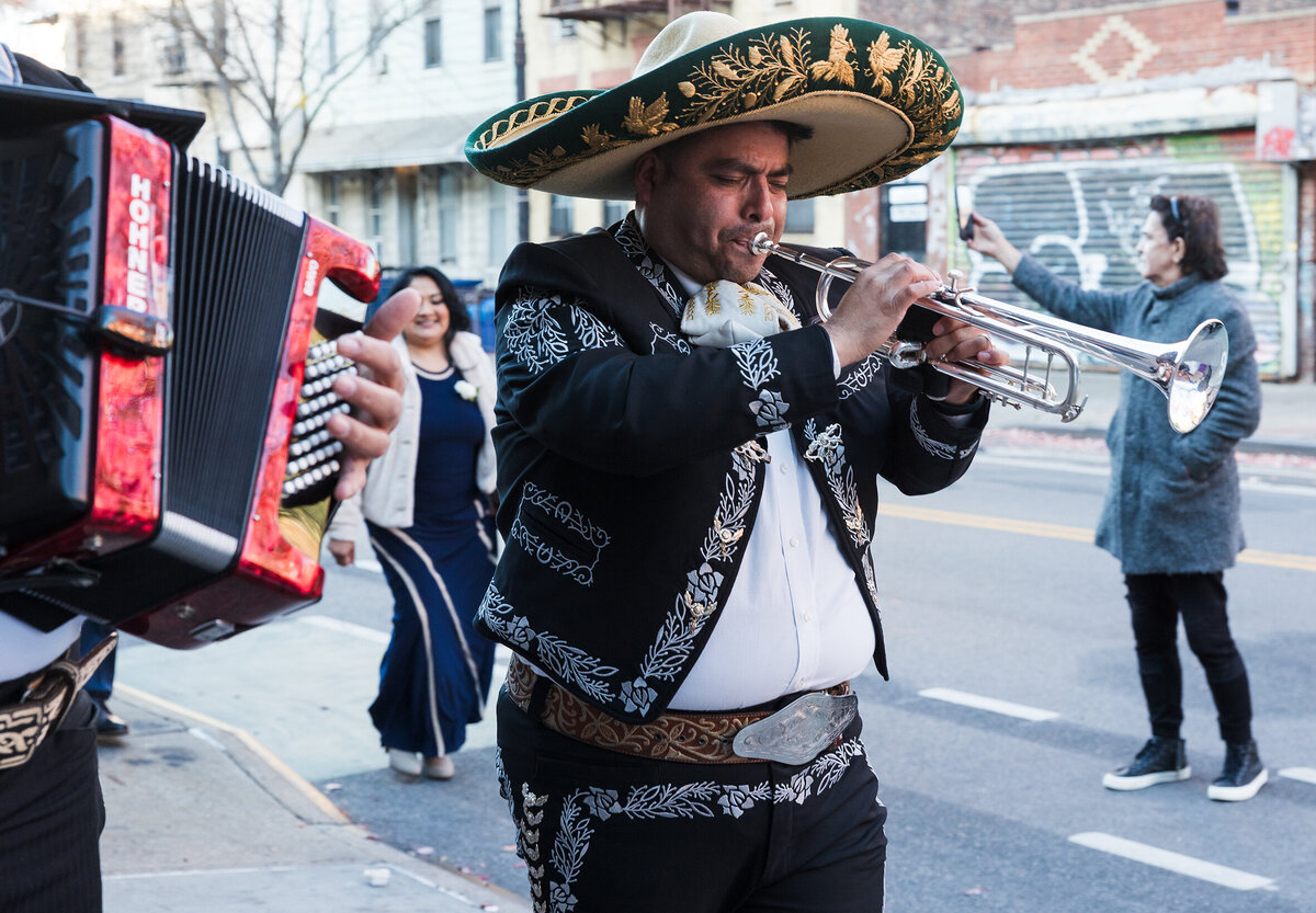 Mariachi playing during the bride's and her family walking to church.