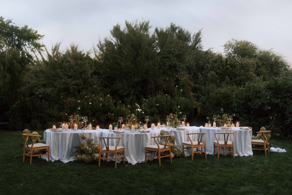 Wedding tablescape overflowing with florals and candles