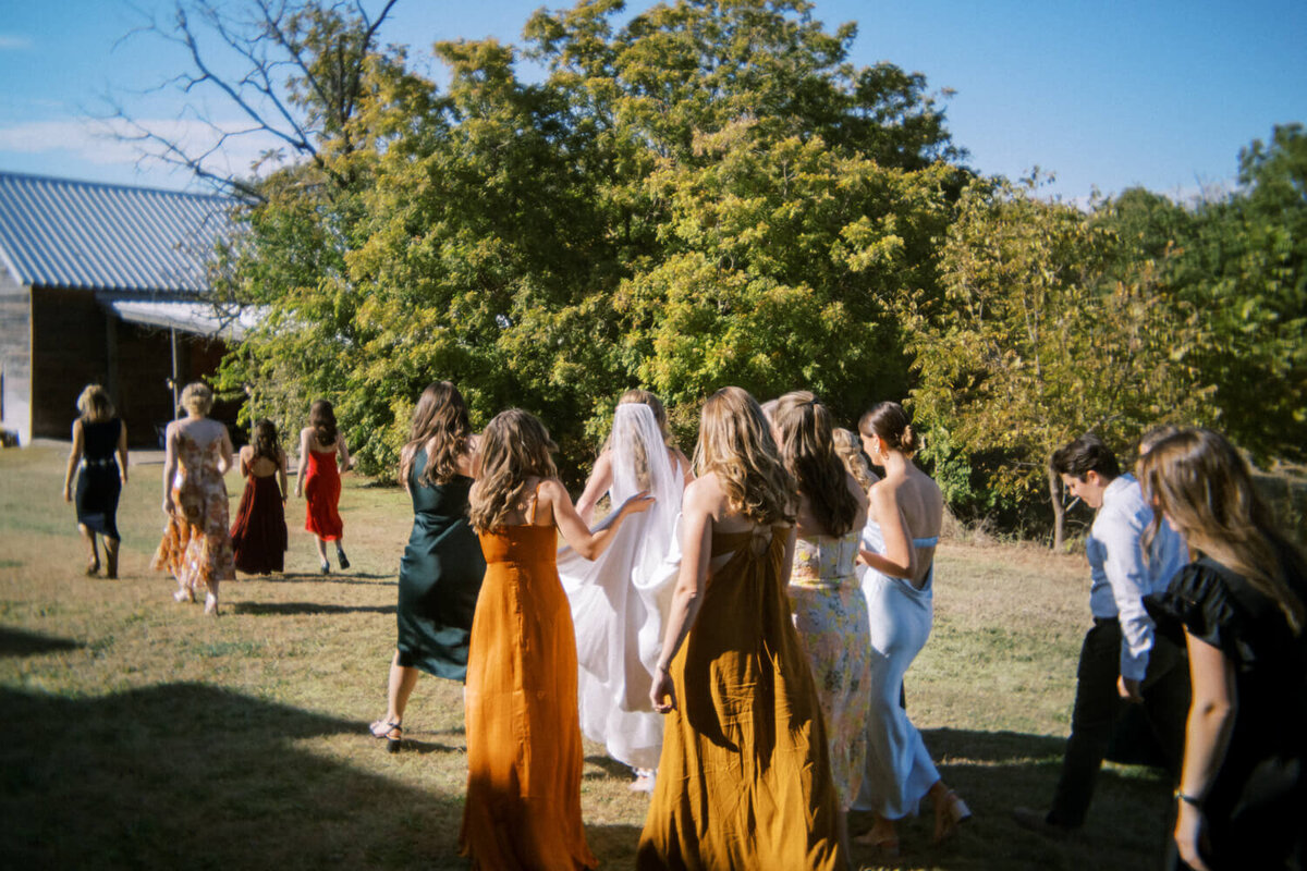 group-of-women-walking-with-bride