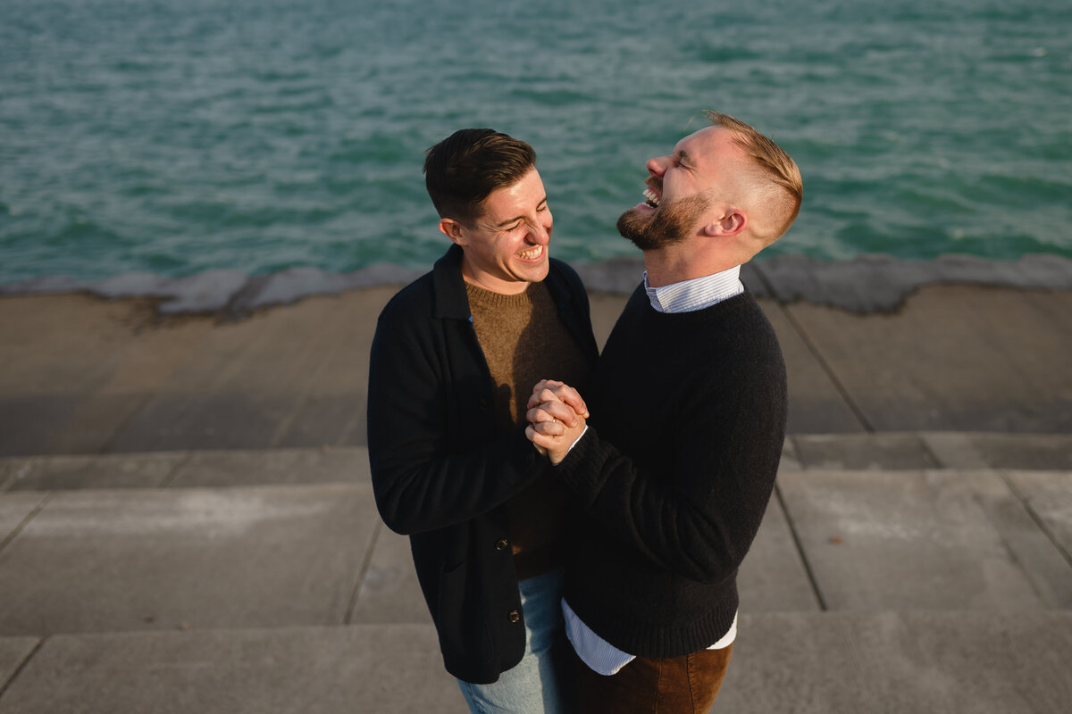 A couple laugh together while on the Chicago Lakefront