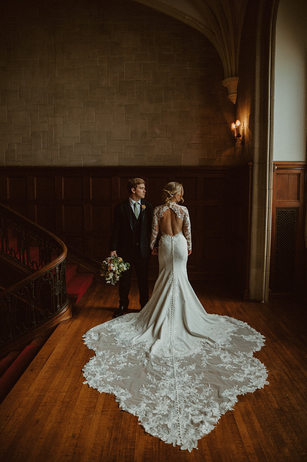 bride and groom stand next to each other in callanwolde fine arts center 