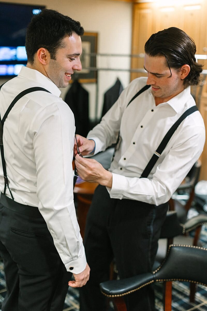 groom-buttoning-suit-jacket-evansville-country-club06