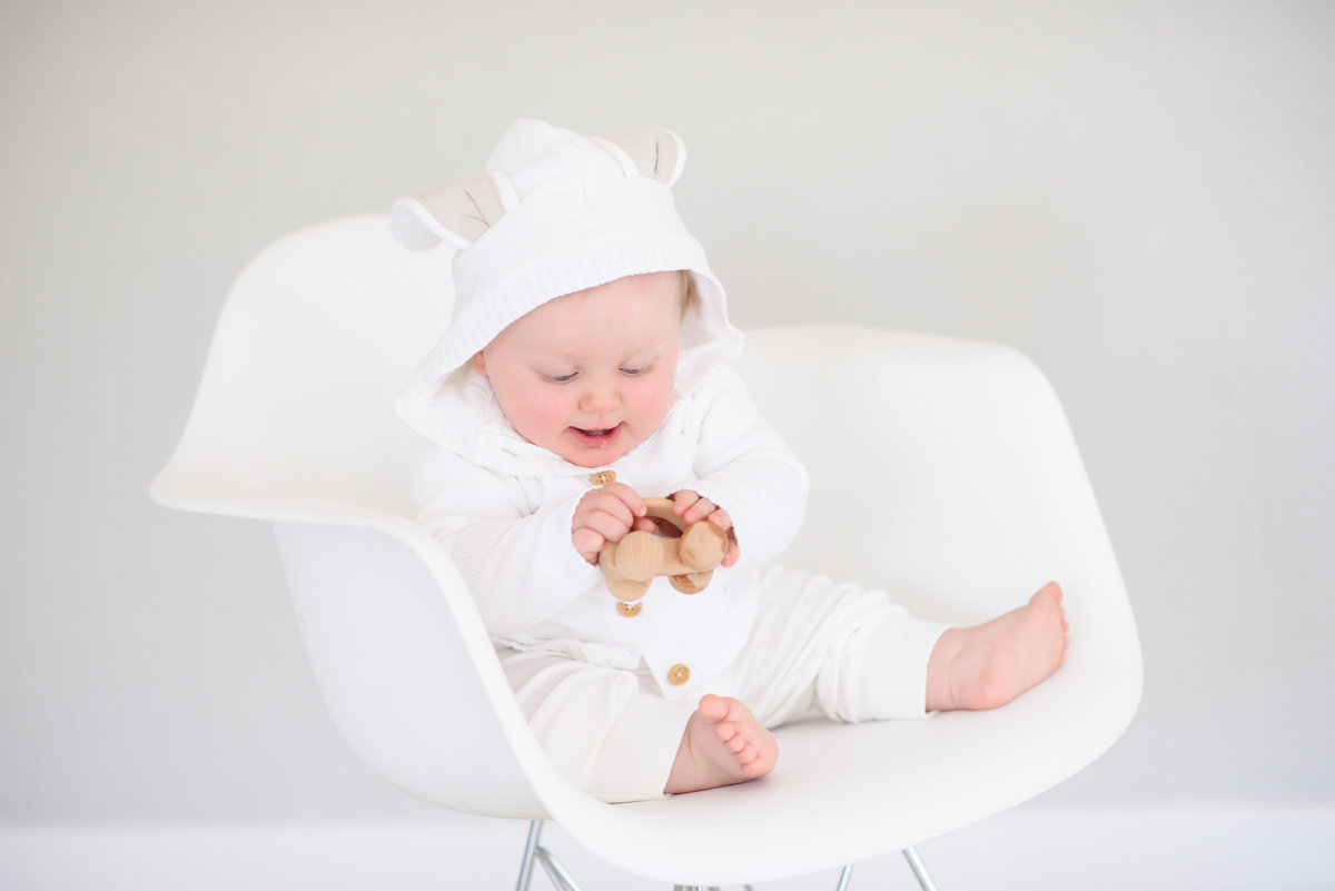 Baby playing with a toy at Tiffany Hix Photography portrait studio in Boise, ID