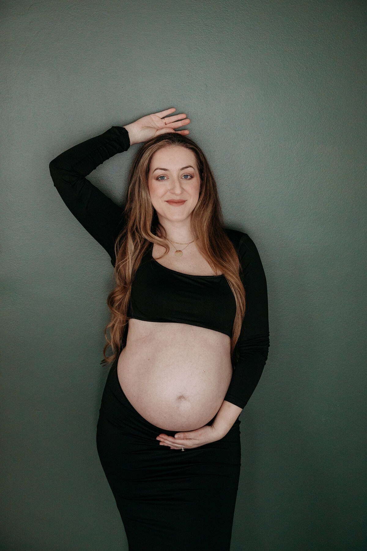 Sexy pregnant mom during a maternity photoshoot in studio in Bartlett ,IL