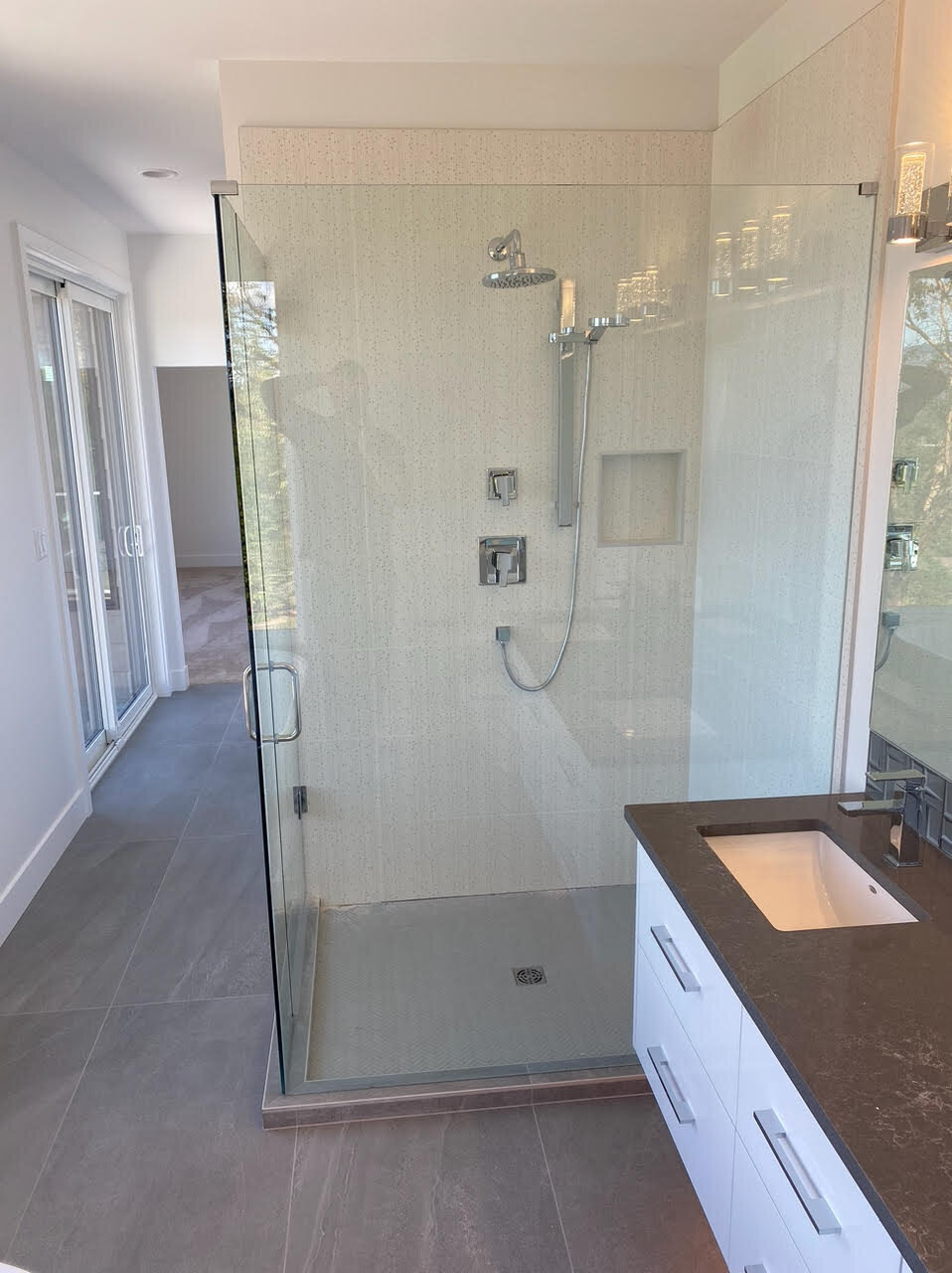 Ensuite design with walk-in shower with glass door.