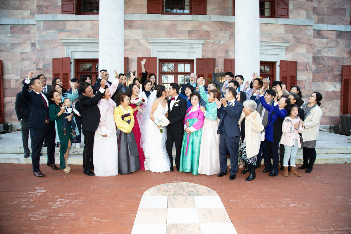 wedding-guests-celebrating-couple-front-of-tate-hou