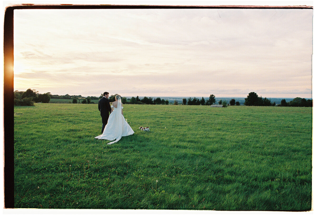 Couple in a field in Carmel, captured in a documentary wedding photography style — Carmel wedding photography by Kate Winters Photography.