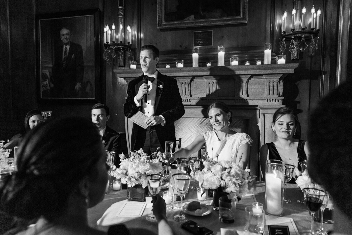 A groom gives a toast at a wedding at the Harold Pratt House