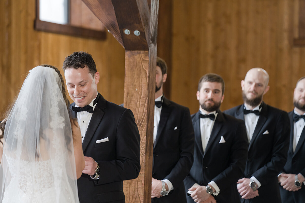 Groom reading his vows