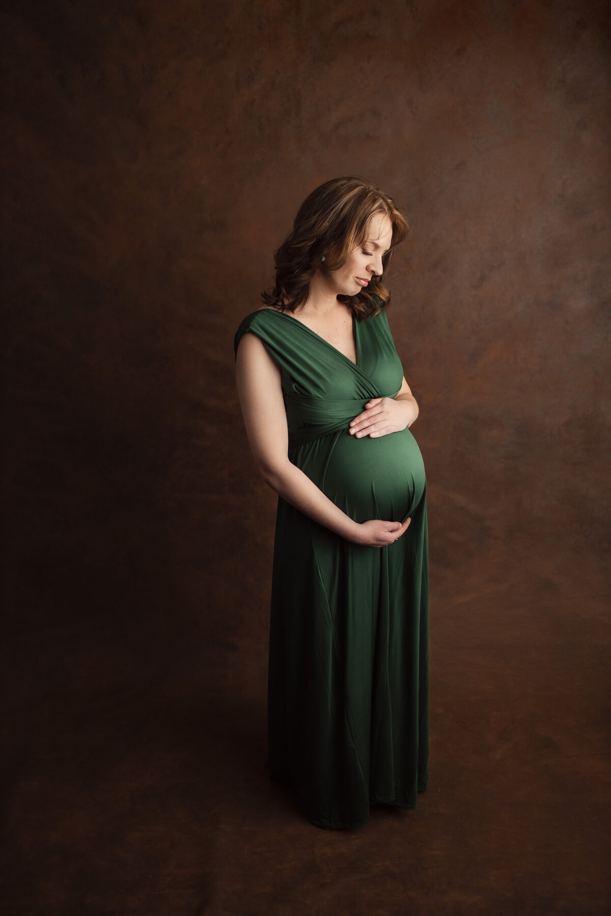 Cradling-her-pregnant-belly
