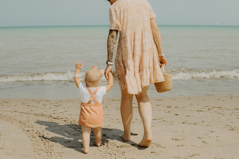 mom and kid on beach