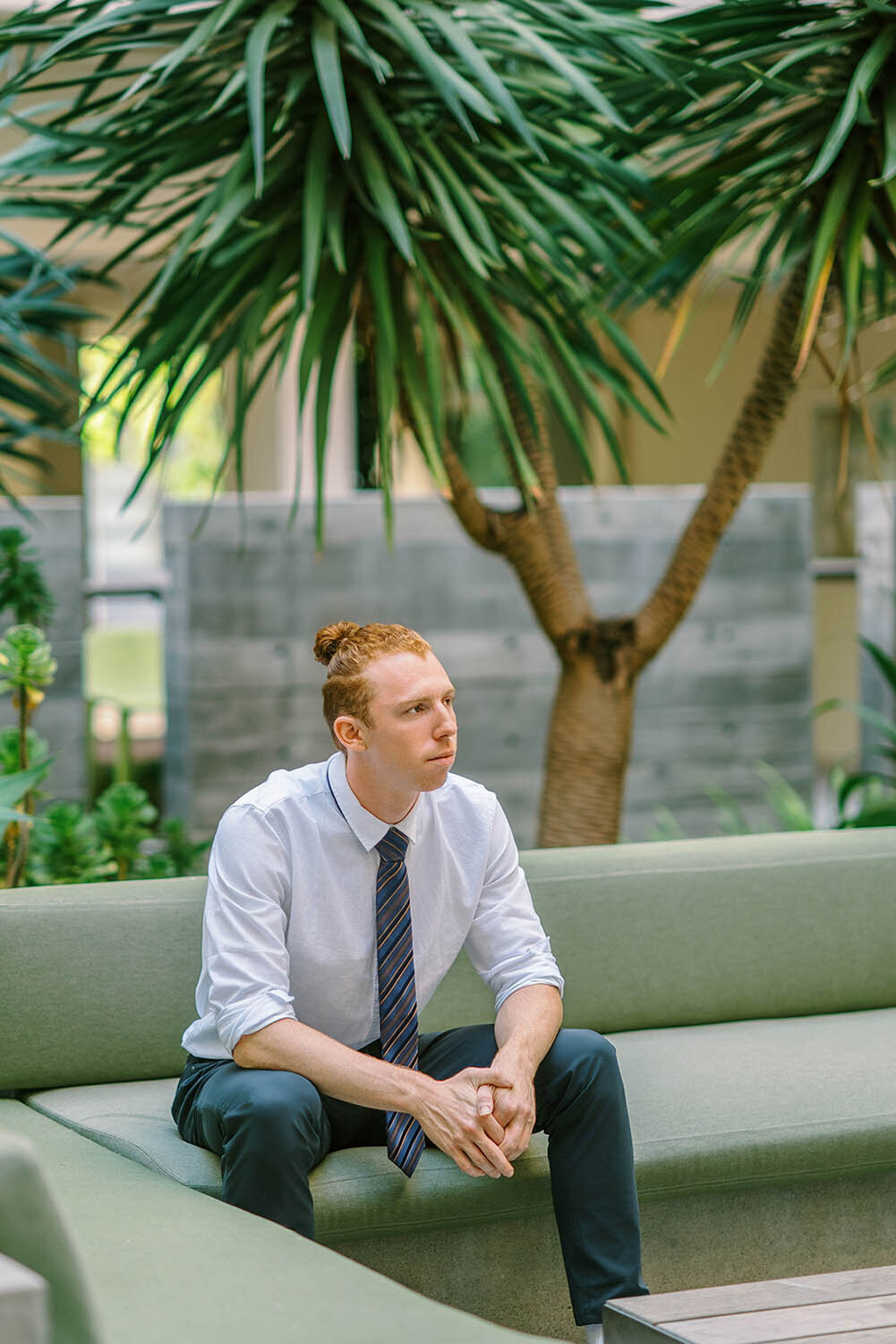 UC San Diego senior guy  sitting on a couch