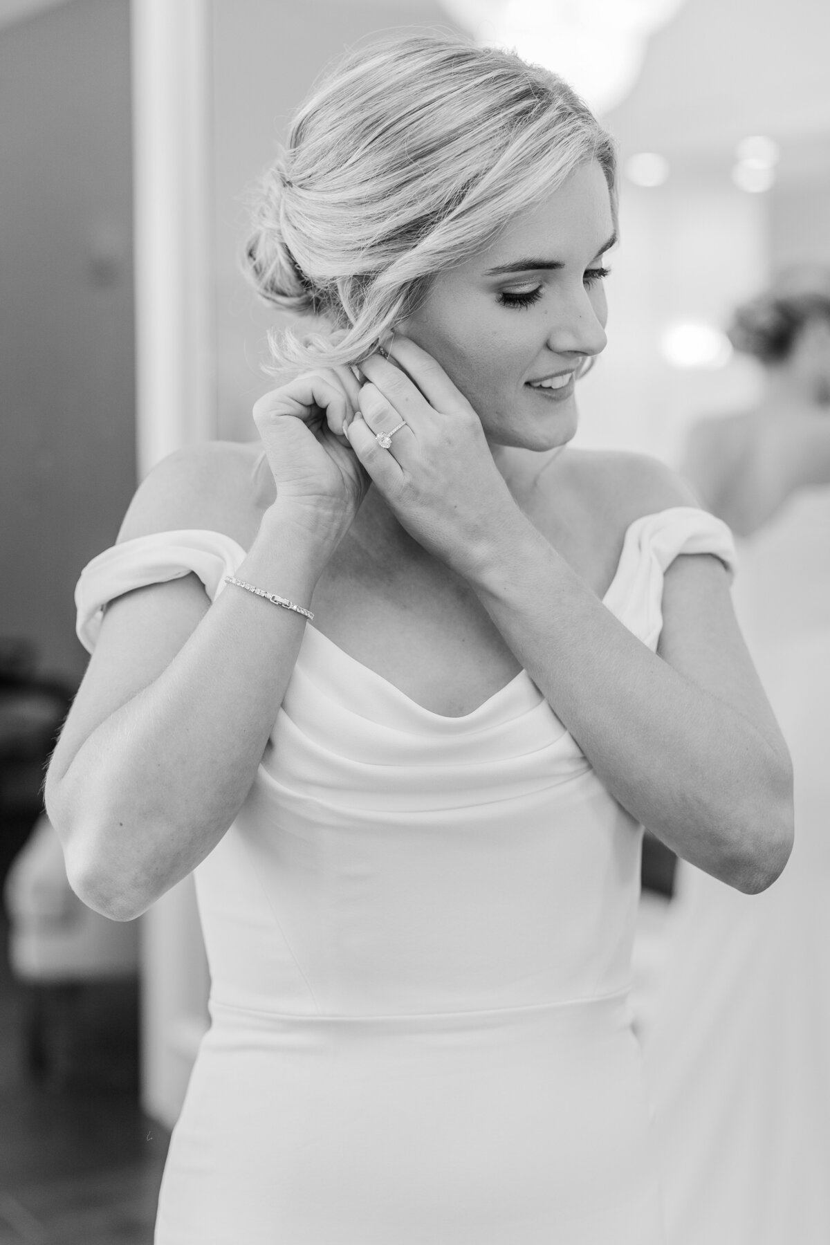 A timeless black-and-white image capturing the bride’s quiet moment getting ready at a luxury wedding venue near Argyle, Texas. Soft lighting and delicate details reflect elegant Southern charm.