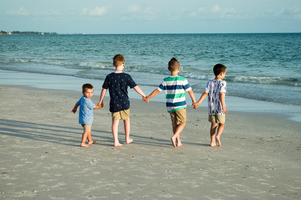 Boys walk on Siesta Key Beach