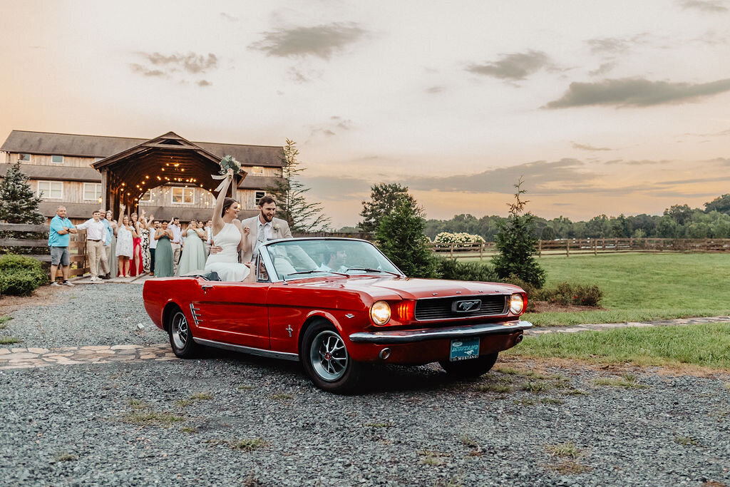 bridge and groom send off in vintage car