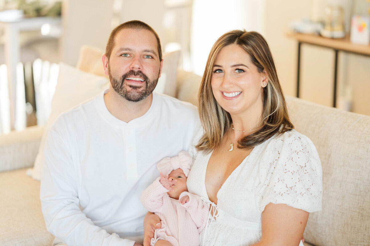 Newborn with mom and dad taken in Douglas, MA by the best newborn photographer in central Massachsuetts