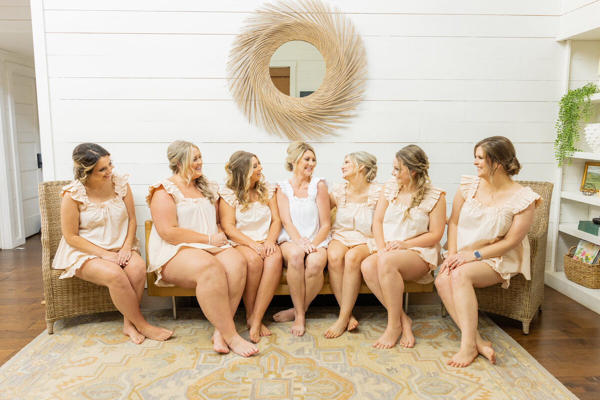 Bride with her bridesmaids in their cute matching PJ's in the bridal cottage at Meadows at Mossy Creek 