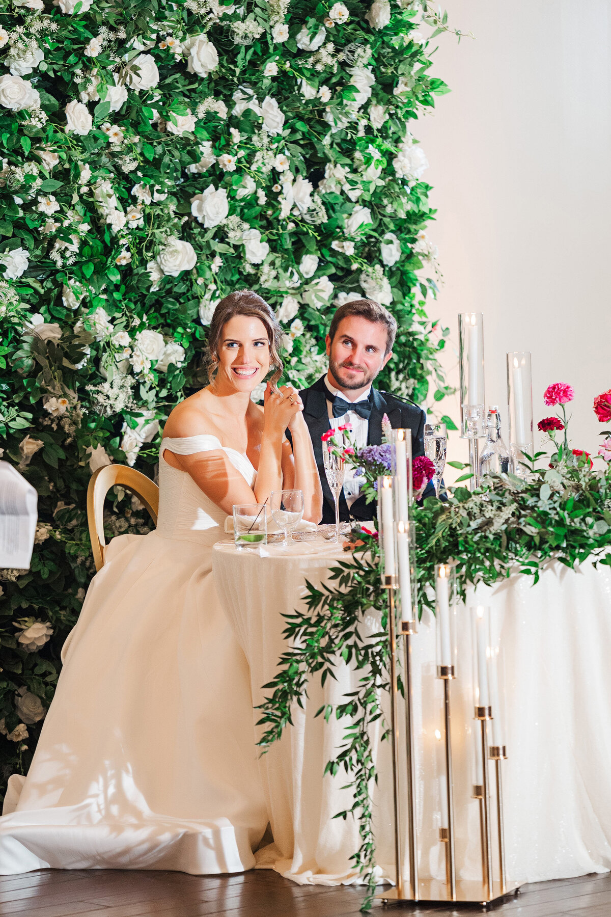 couple listening to wedding toasts