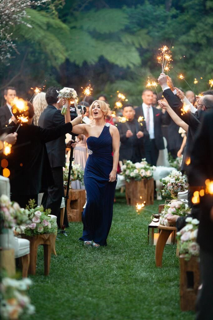 A bridesmaid walking back up the aisle